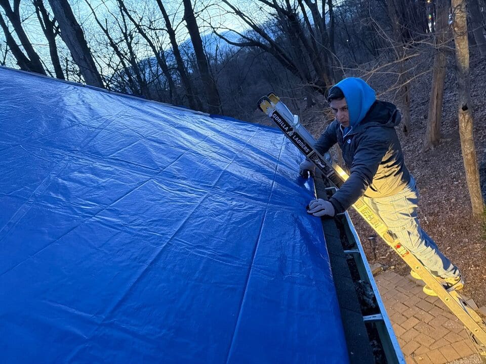 Emergency roof repair crew responding after a storm
