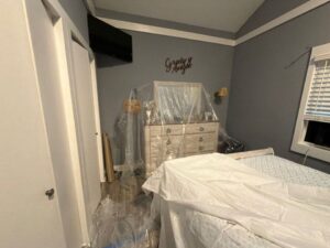 Water damage from roof leak on a bedroom ceiling