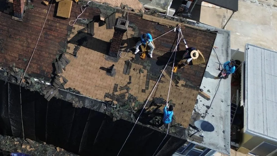 Emergency roof repair crew responding after a storm