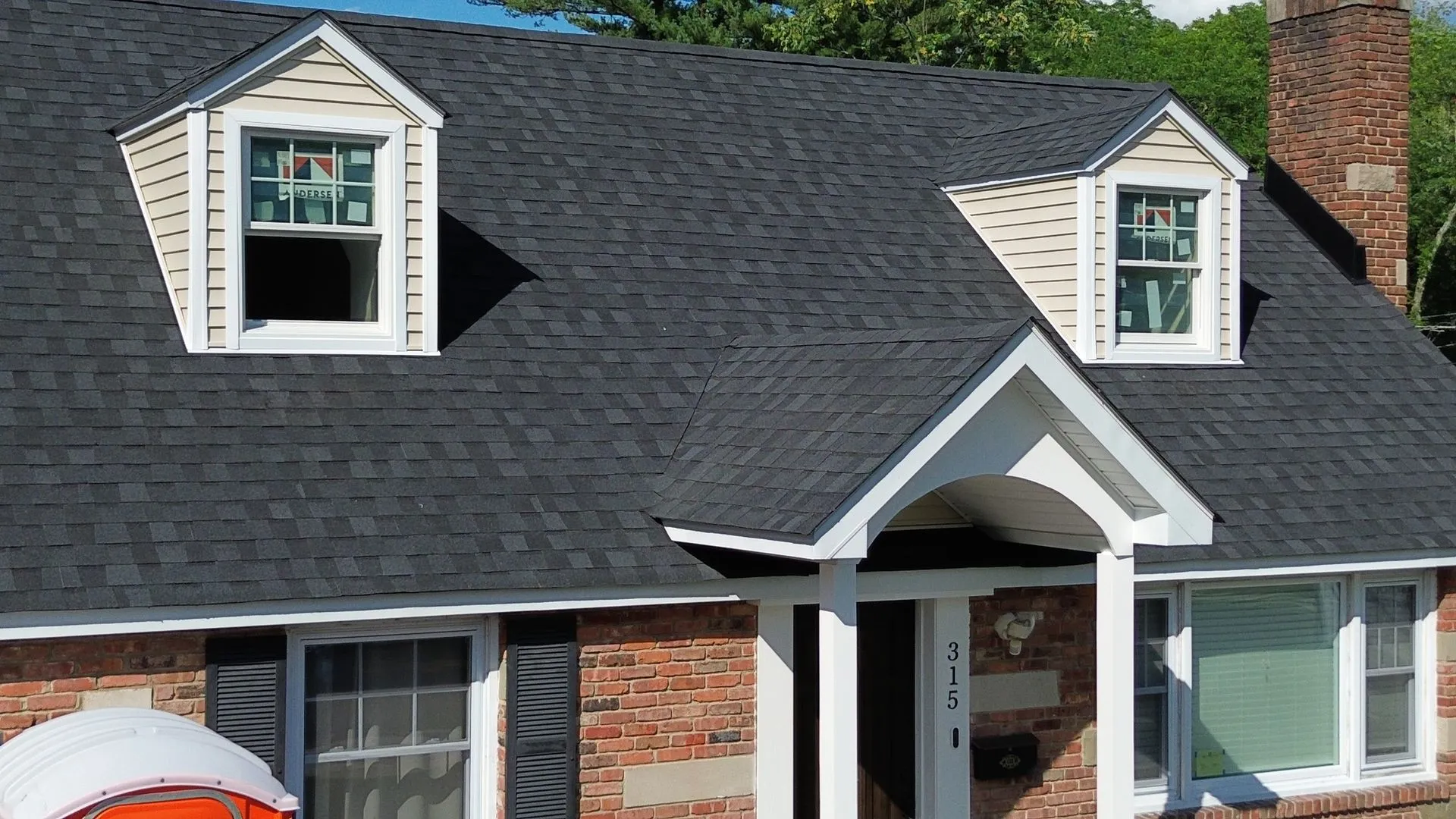 Aerial view of a completed roof replacement installed by Jay Global Home