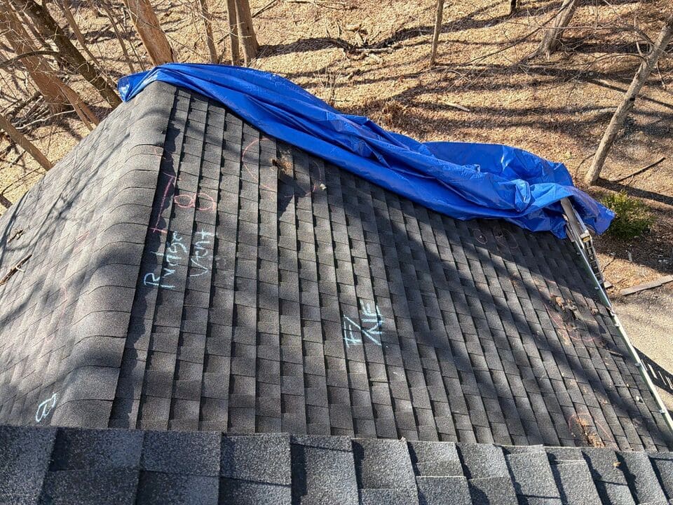 Emergency roof repair crew responding after a storm