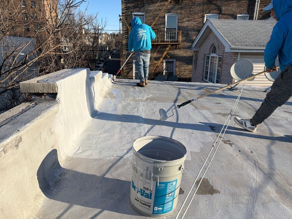 Commercial roofing services team working on a business rooftop