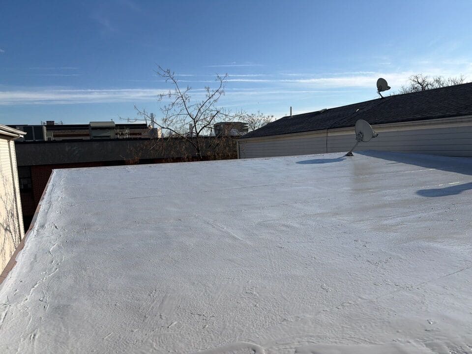 Commercial roofing company crew inspecting a flat roof