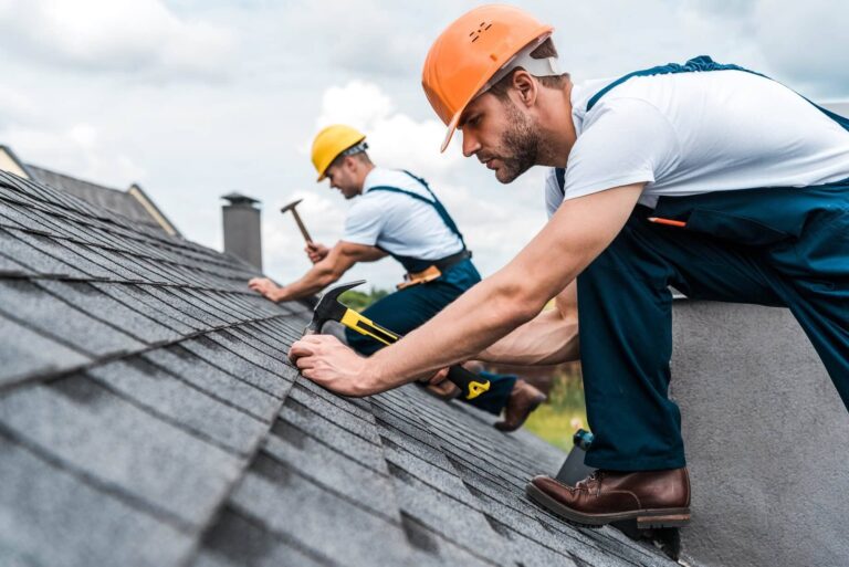 Jay Global Home roofers inspecting a roof